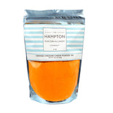The Hampton Popcorn Company bolsa frontal mostrando polvo cheddar, perfecta para sazonar