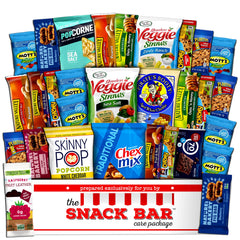 The Snack Bar caja frontal abierta con 30 snacks variados, ideal para compartir