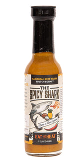 The Spicy Shark botella frontal mostrando etiqueta y aroma caribeño