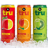 Tru variedad pack frontal mostrando las tres latas y beneficios orgánicos
