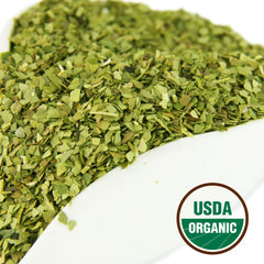 U.S. Wellness Naturals bolsa abierta con cucharada mostrando grano sin polvo