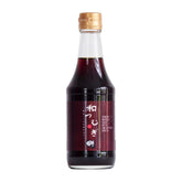 Watsumugi botella frontal mostrando producto y sello japonés, aporta calidad auténtica