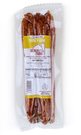 Wenzel's Farm paquete frontal de palitos de jamón con miel mostrando etiqueta y tamaño, perfecto para snack
