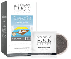 Wolfgang Puck caja delantera Breakfast in Bed mostrando 16 cápsulas y beneficios compostables