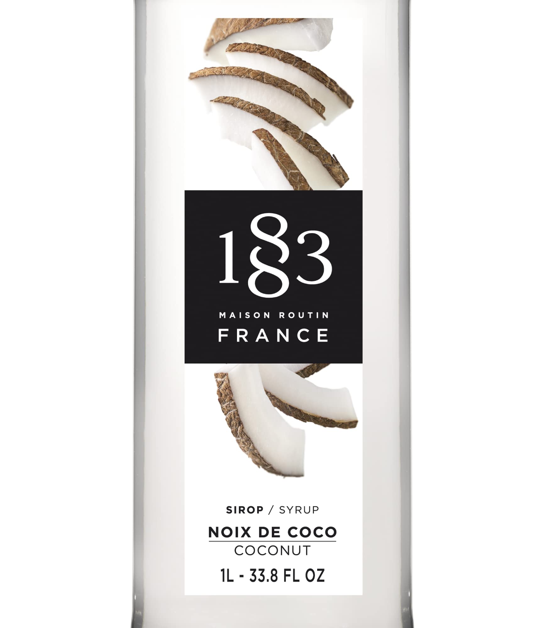 1883 Maison Routin sirope de coco vertiéndose en vaso ofreciendo mezcla homogénea