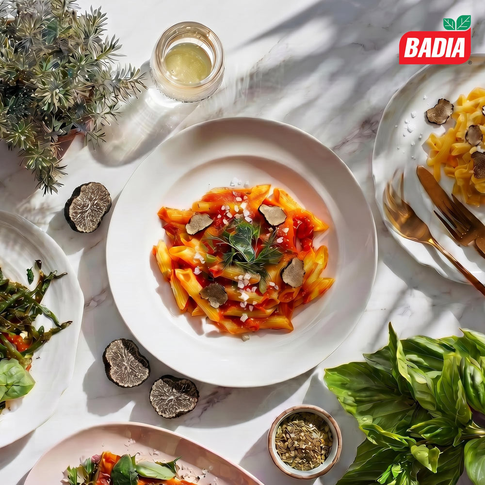 Badia sal trufa negra espolvoreada sobre pasta resaltando sabor elevado