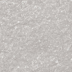 Comparación de tamaño Bakell Tinker Dust blanco junto a utensilios repostería