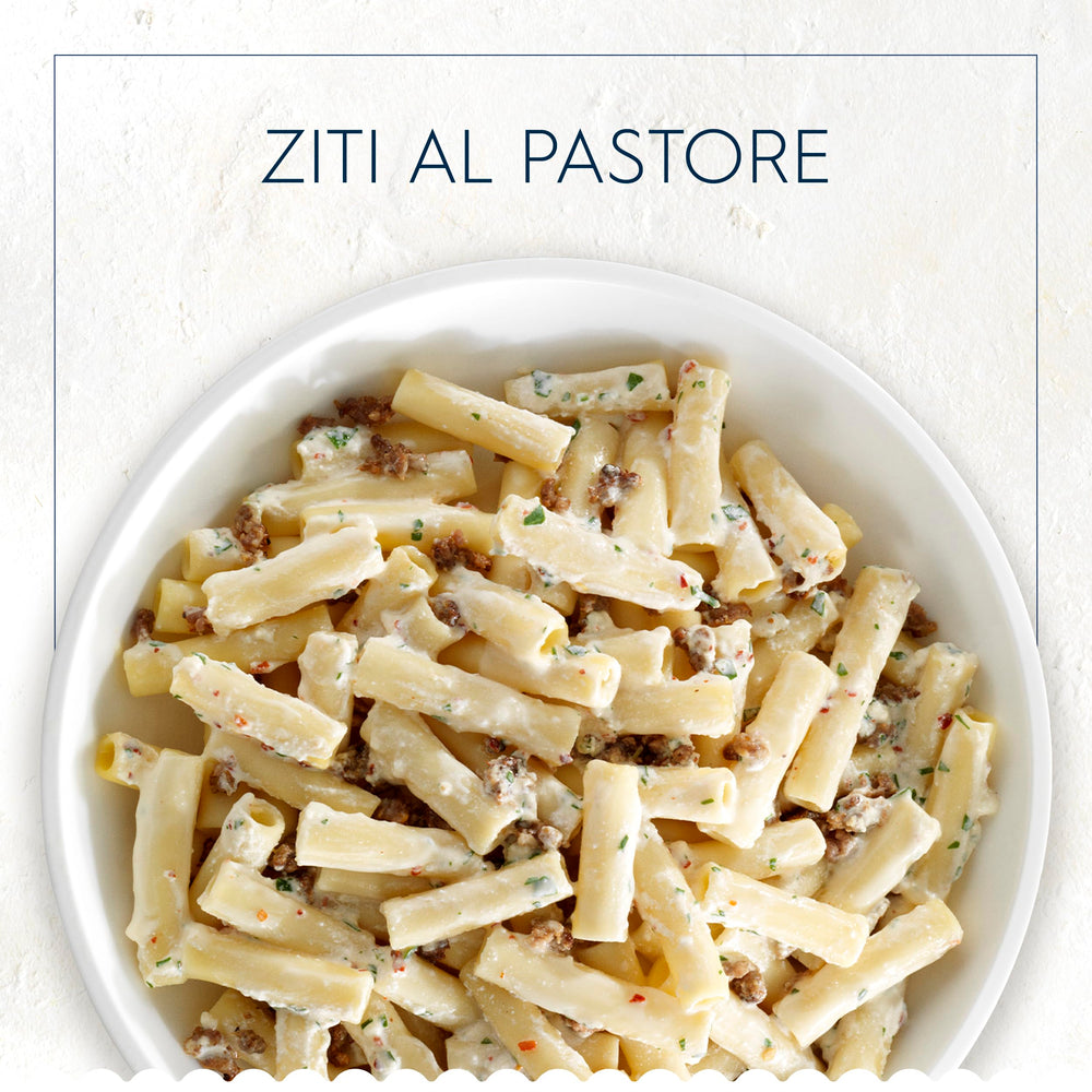 Barilla ziti cocido en plato con salsa, presentación apetecible y uniforme