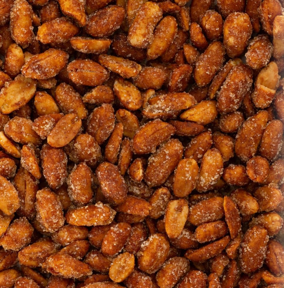 Belmont Peanuts cacahuete en mano para comparar tamaño extra grande Virginia