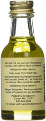 Boyajian aceite de limón botella junto a un bizcocho demostrando aroma intenso