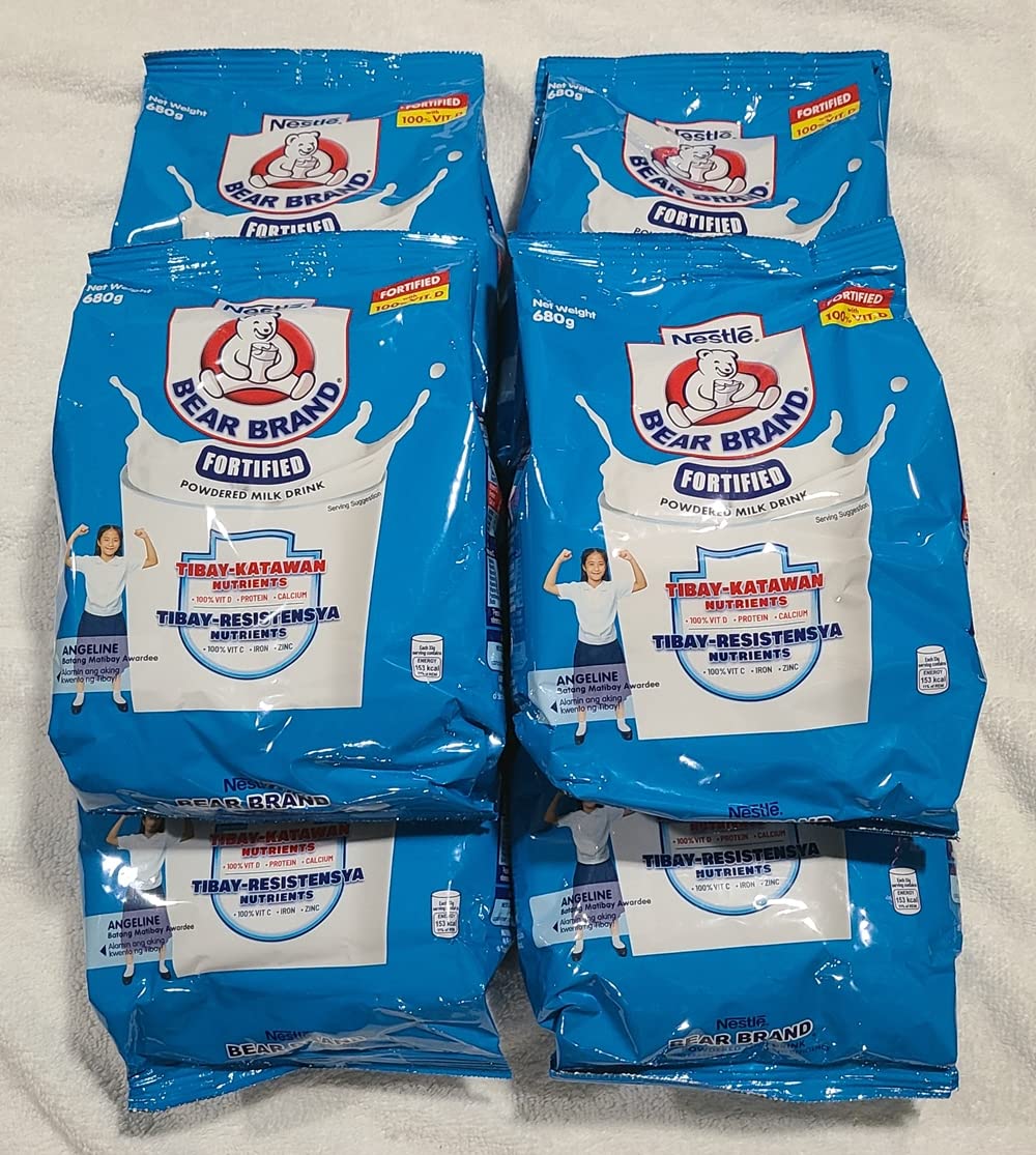 BUTO Bear Brand envase junto a mano para comparar tamaño y porciones