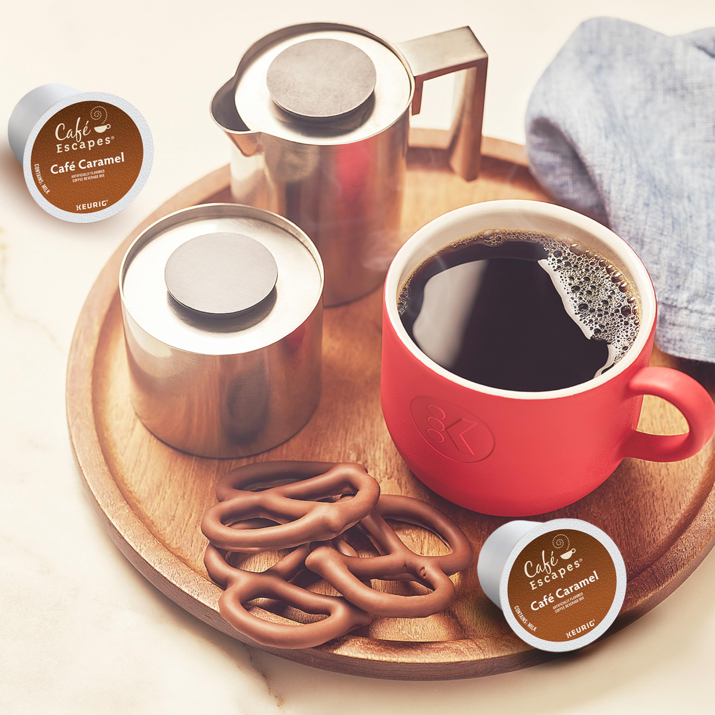 Café Escapes caja abierta con 24 cápsulas visibles, facilita abastecimiento para el hogar