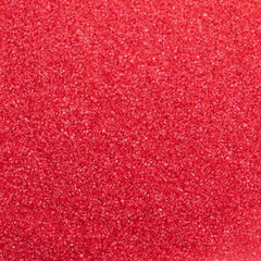 Cake Mate azúcar roja decorando cupcake con acabado profesional