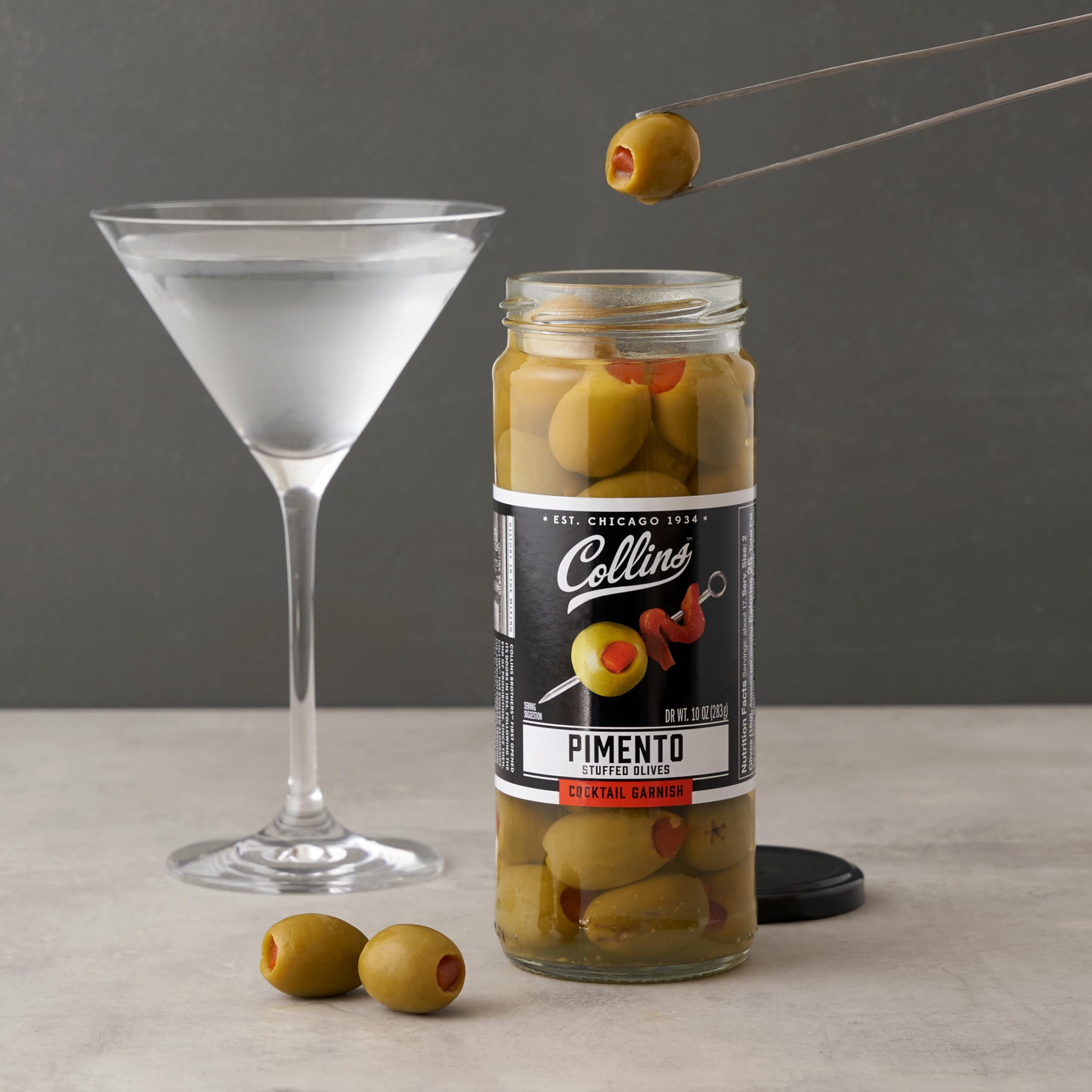 Collins Chicago aceitunas en tabla con quesos, complementan charcutería gourmet