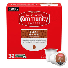 Community Coffee caja frontal que muestra 32 cápsulas y sabor praliné
