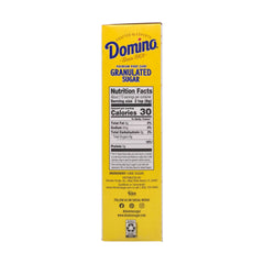Domino azúcar en cuchara para porcionar con precisión
