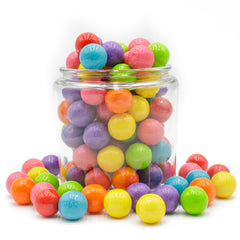 Donty-Tonty gumballs en frascos sobre mesa de dulces ideal para eventos