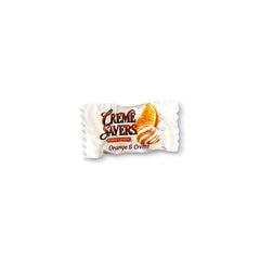 Dr. Variety primer plano del caramelo naranja y crema, detalle de textura y brillo apetitoso