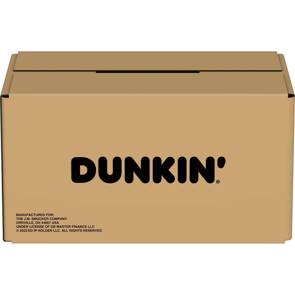 Dunkin’ cápsulas sobre mesa de madera aspecto natural y hogareño