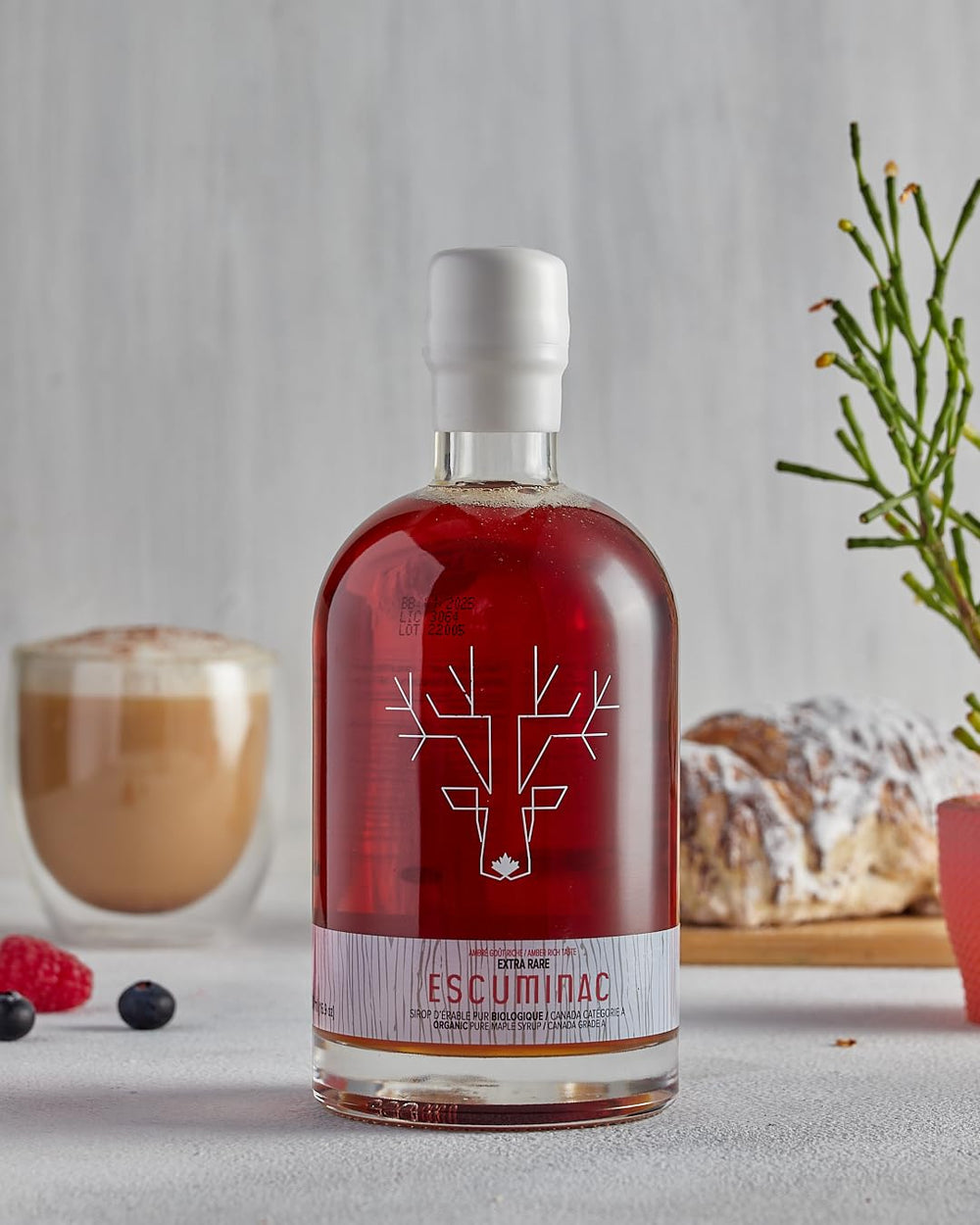 Escuminac savia y tronco de arce, enfatiza origen natural y autenticidad