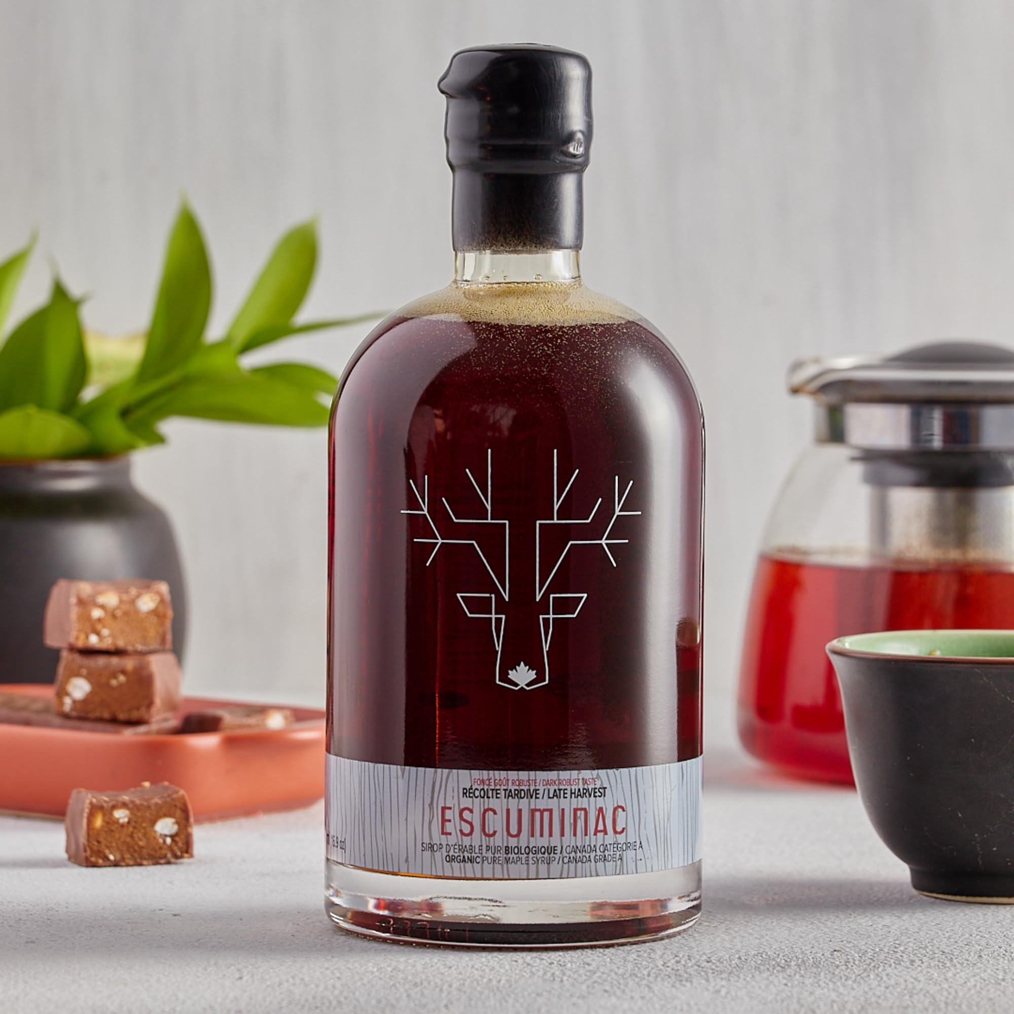 Escuminac tres botellas dispuestas para comparar sabores distintos