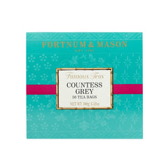 Fortnum & Mason bolsita individual junto a hojas, muestra aroma cítrico