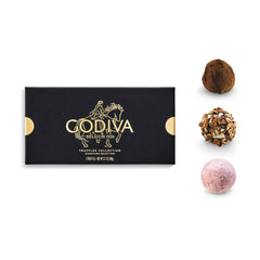 Godiva primer plano de trufa partida mostrando centro cremoso y textura sedosa