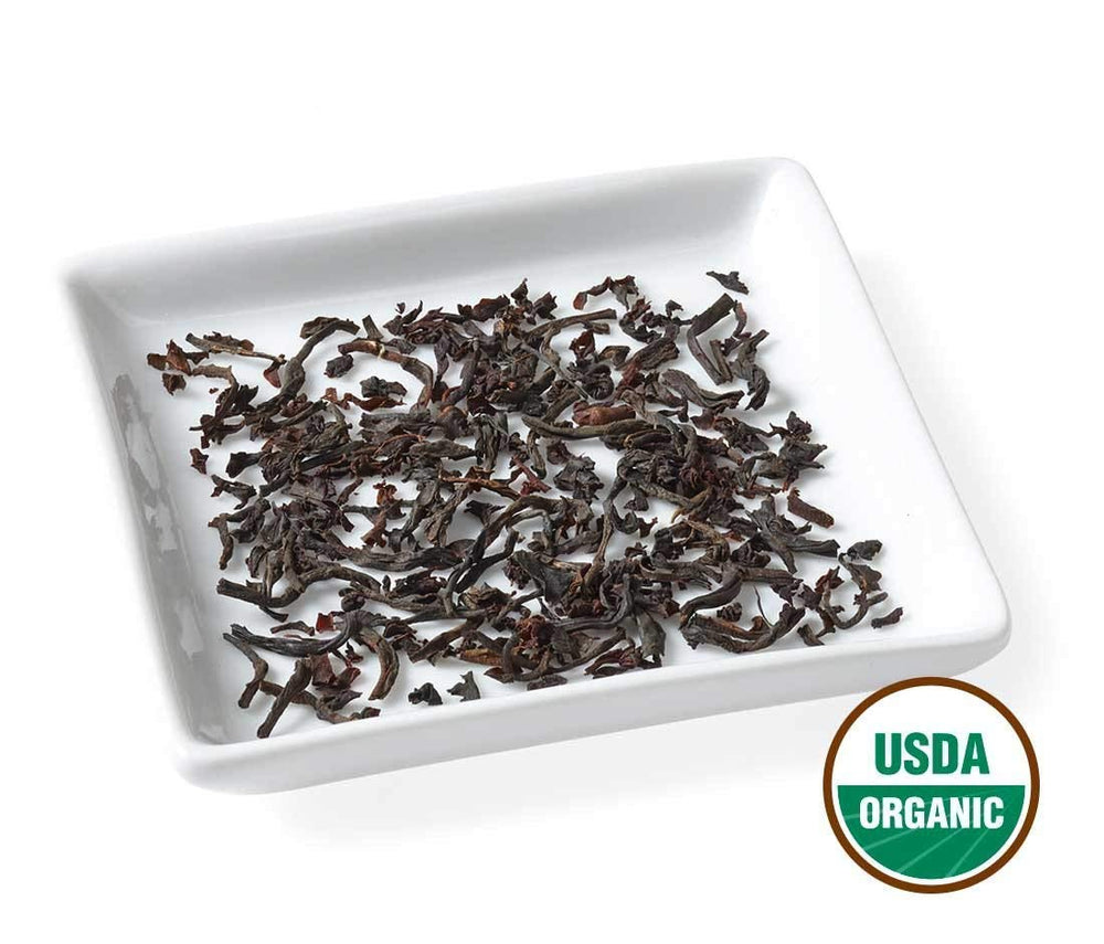Golden Moon Tea desayuno en mesa con ambiente cálido y acogedor