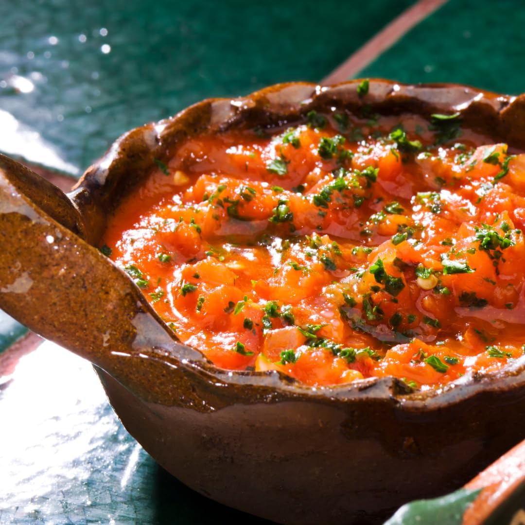 GranAroma frasco en cocina junto a ingredientes sugiriendo uso versátil
