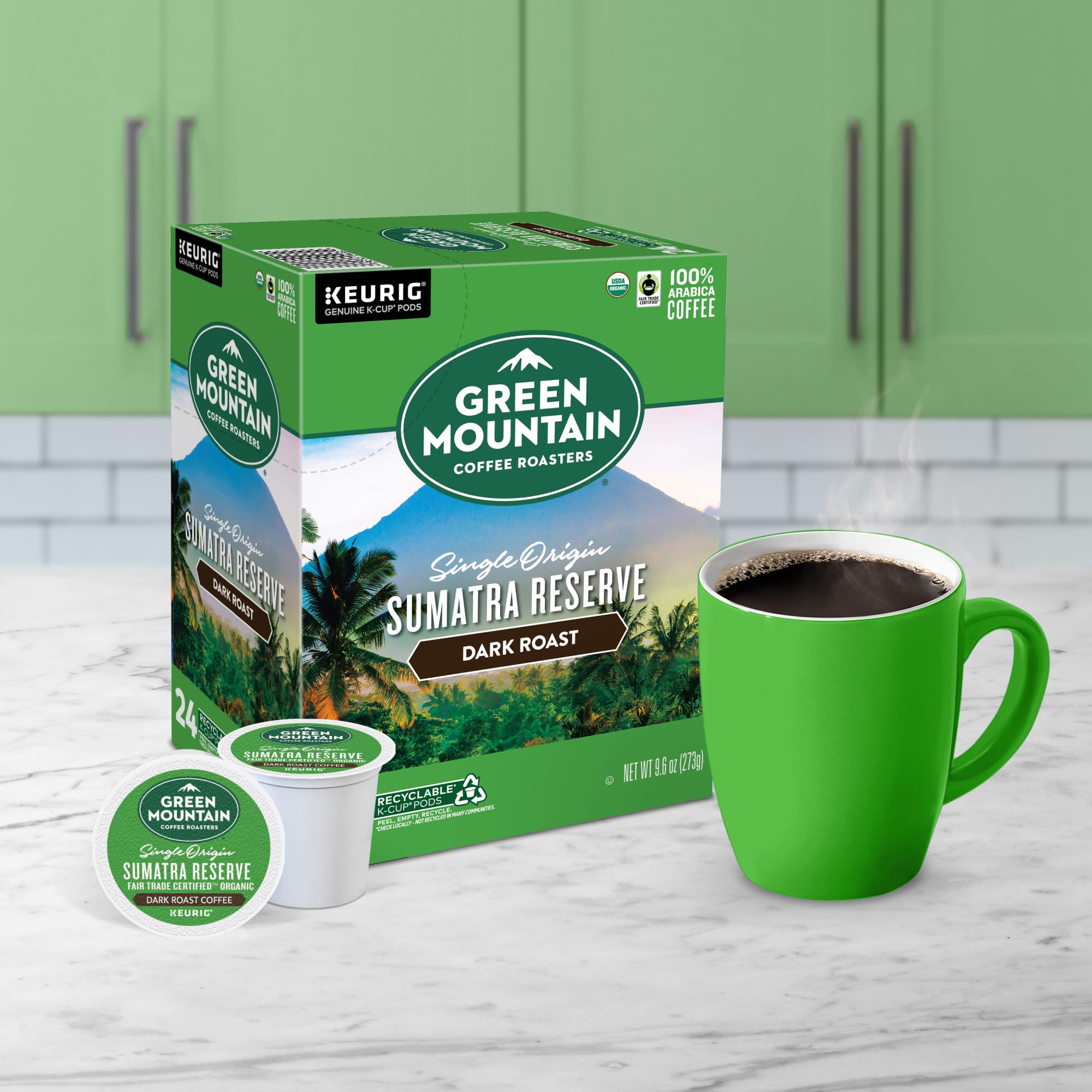 Green Mountain Coffee Roasters cápsula junto a moneda para comparar tamaño práctico