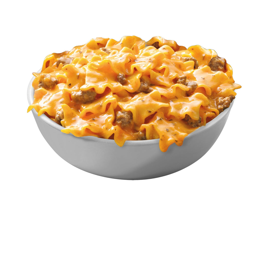 Hamburger Helper paquete junto a objetos cotidianos para comparar tamaño y conveniencia