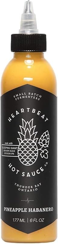 Heartbeat Hot Sauce Co. salsa Pineapple Habanero sobre tacos, realza sabores