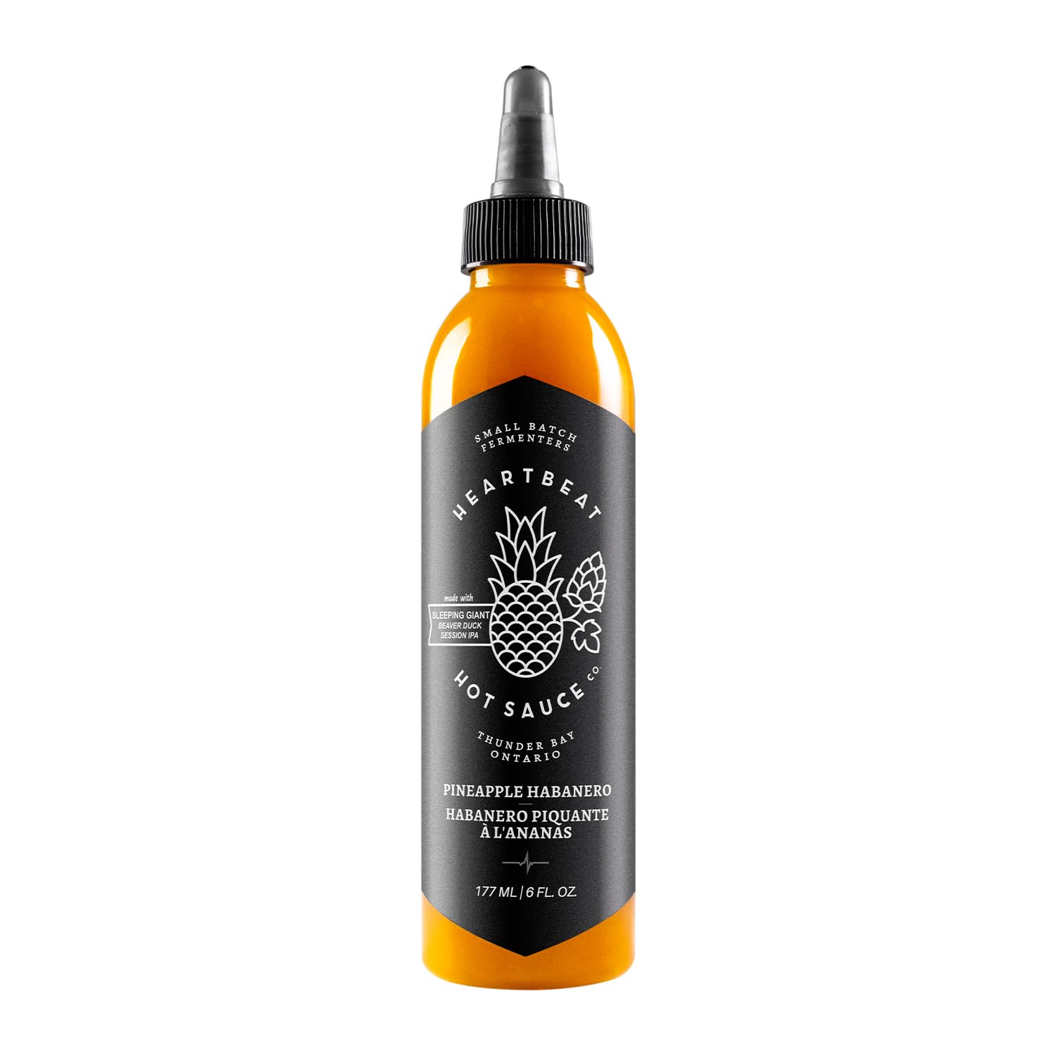 Heartbeat Hot Sauce Co. botella frontal mostrando etiqueta y color vibrante