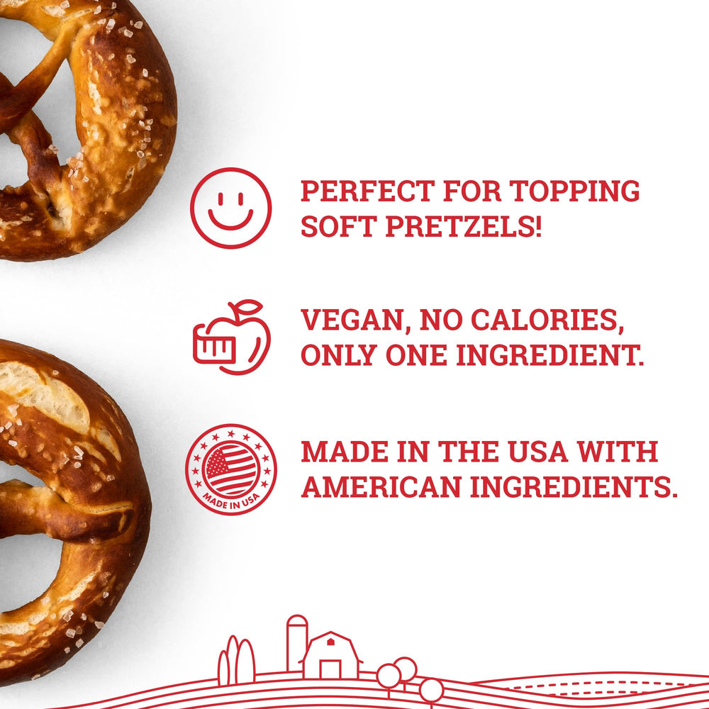 Hoosier Hill Farm mano espolvoreando sal sobre pretzel para sabor y textura