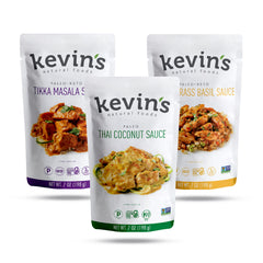 Kevin's Natural Foods frascos frontales del pack triple mostrando etiquetas claras y variedad