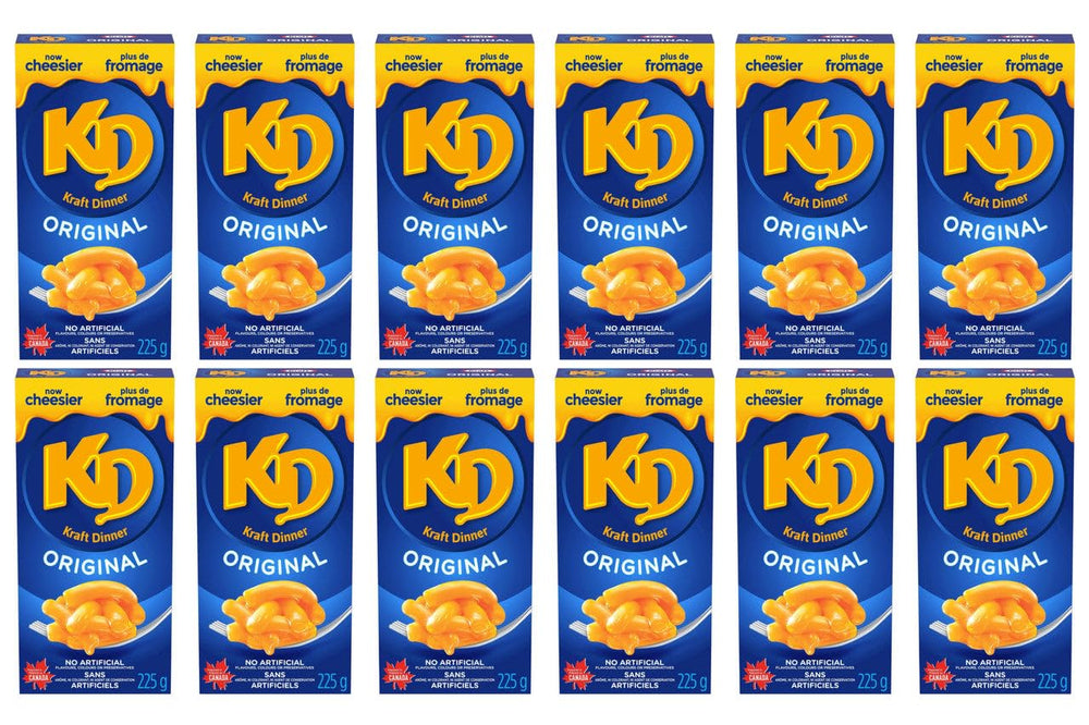 Kraft Dinner sobre de polvo de queso abierto listo para mezclar, sabor cremoso práctico