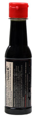 La Perrona botella Roasted sostenida en mano mostrando tono rostizado