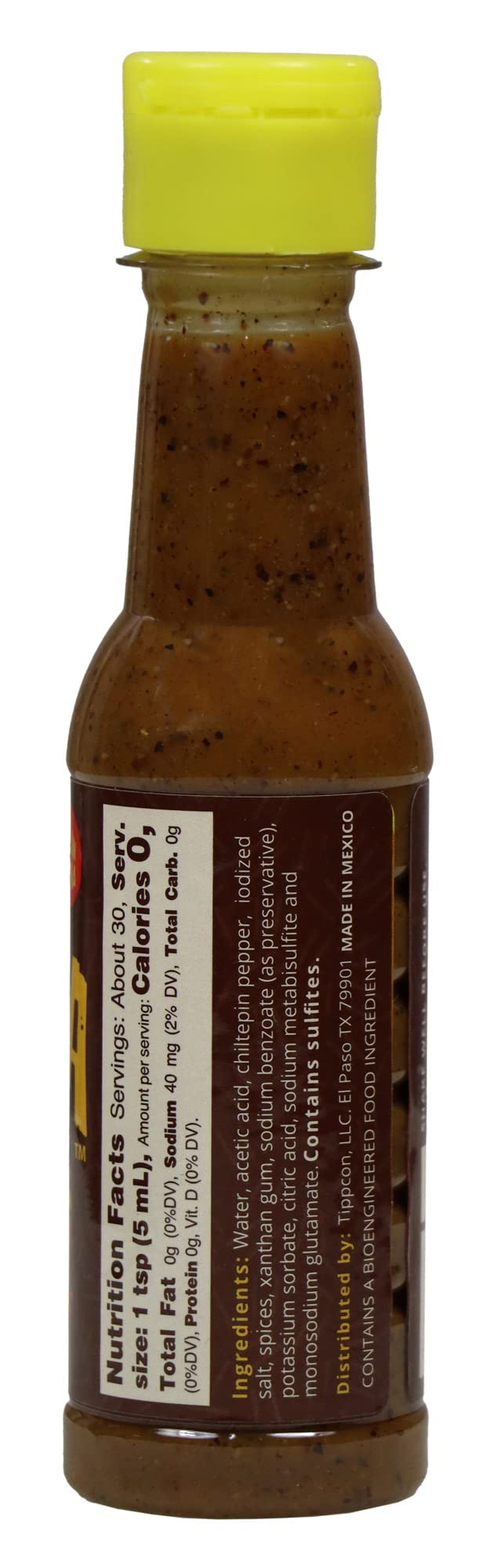 La Perrona salsa Verde vertida sobre taco para frescura y acidez