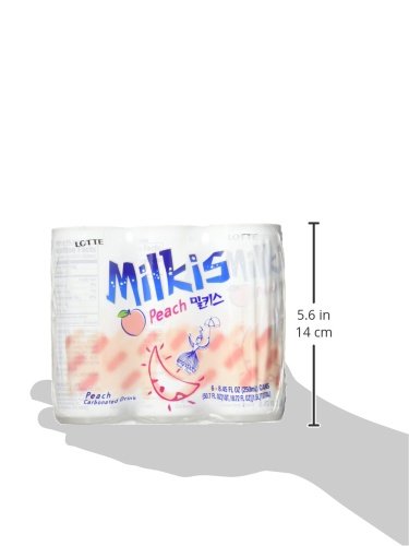 Lotte Milkis melocotón lata en mano para tamaño y portabilidad