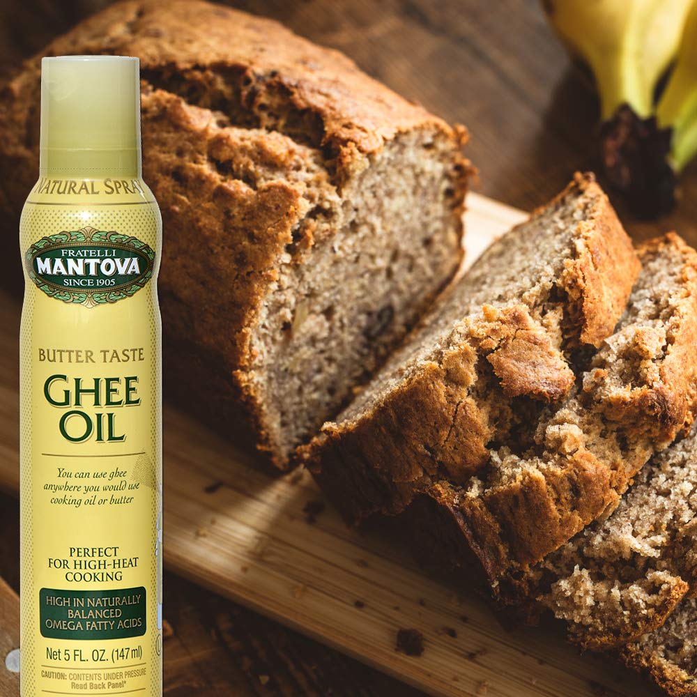 Mantova spray ghee comparación de tamaño de la botella 5 fl oz en mano