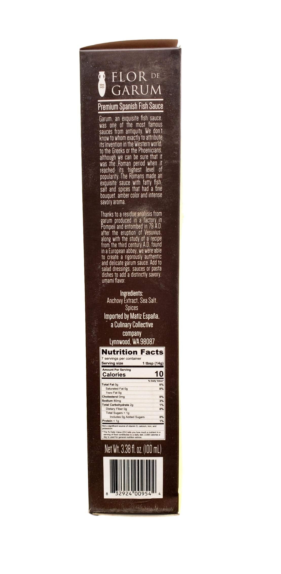 Matiz Flor de Garum al lado de una taza para comparar tamaño de 100 ml