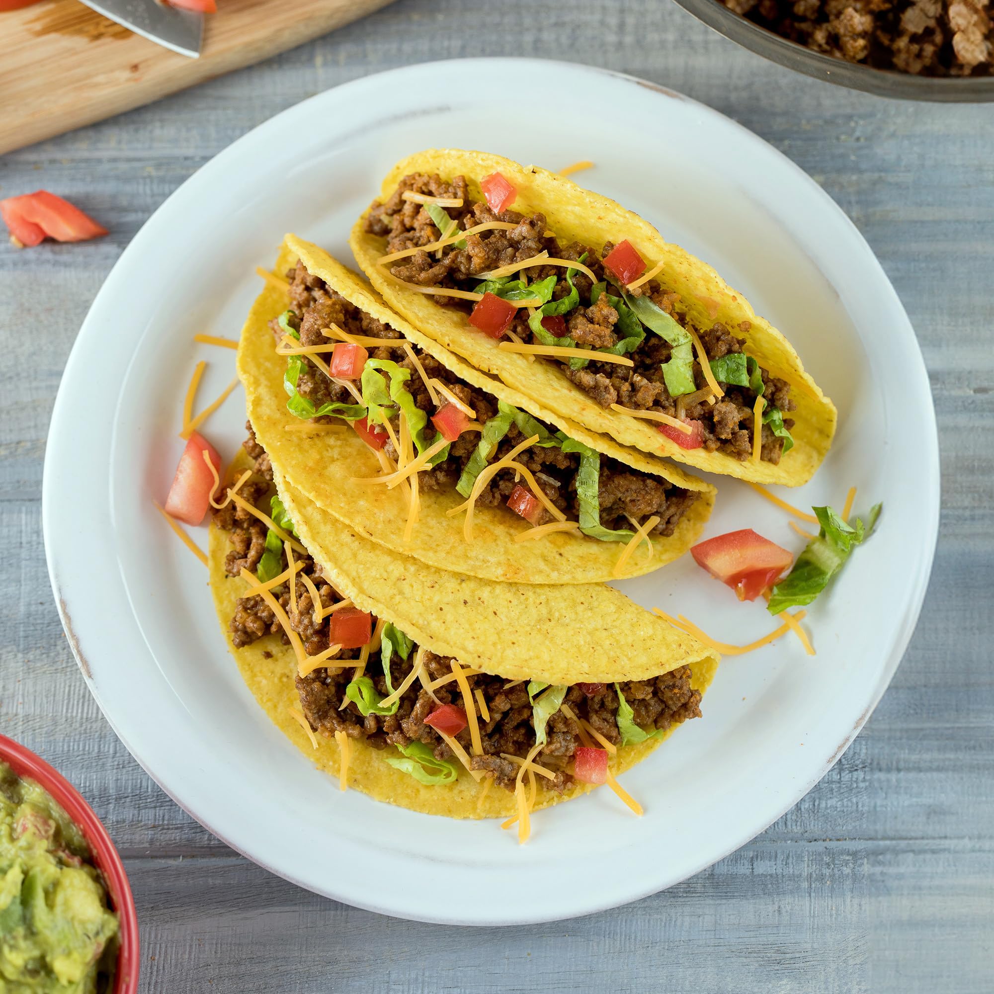 McCormick sazonando carne en sartén para tacos en pocos minutos