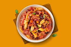 Miss Olive's Chicken Pasta Parm en un tazón listo para comer, proteína y sabor al instante