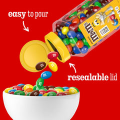 M&M's tarro en mano para comparar tamaño y transportar cómodamente