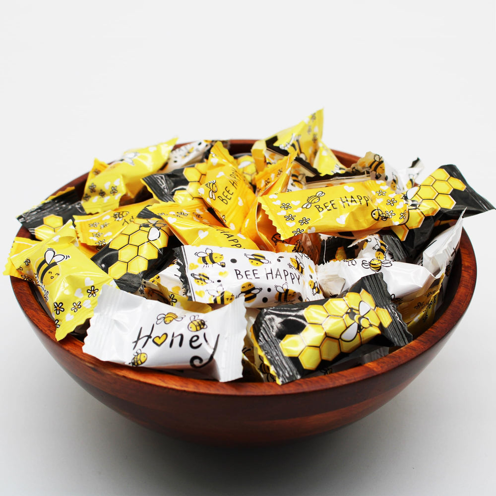 Naturejam frasco decorativo con caramelos abeja destacando presentación en mesa
