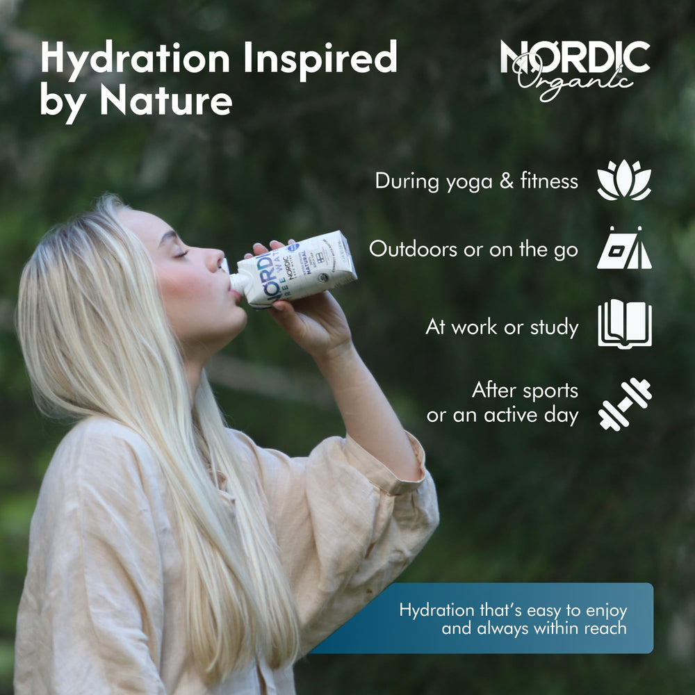 Nordic Tree Water junto a abedules en bosque finlandés enfatizando origen sostenible