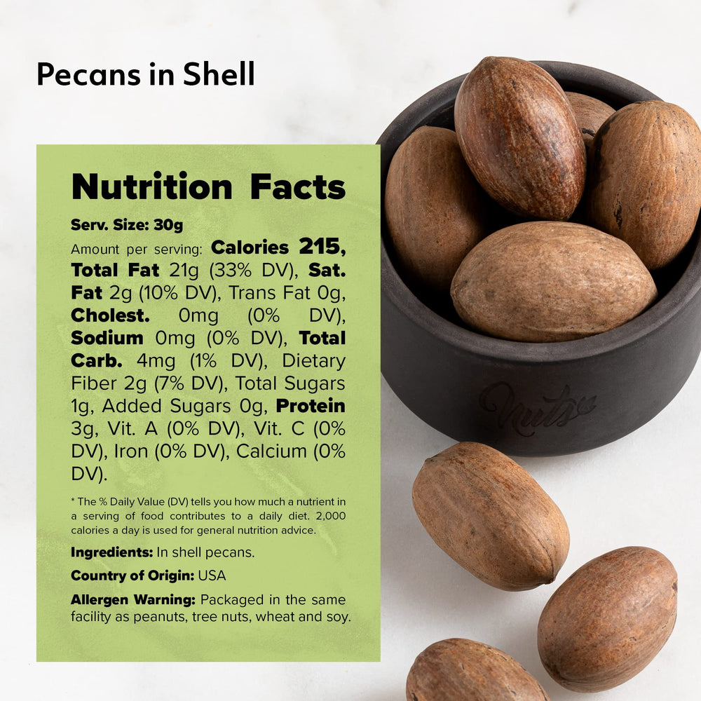 NUTS U.S. pecanas junto a una regla para comparar tamaño y porción