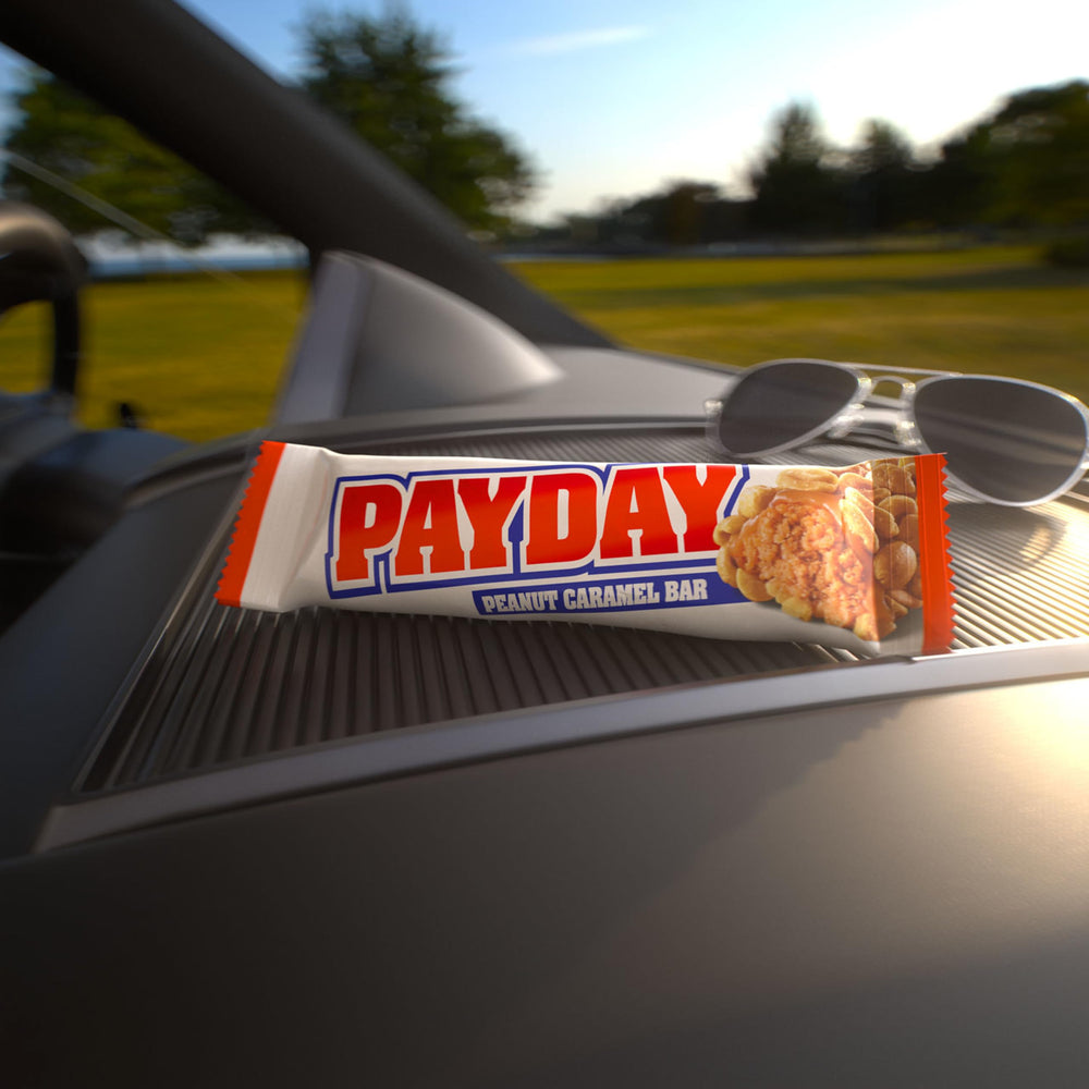 PayDay barra en mano mostrando tamaño práctico para llevar y controlar porciones