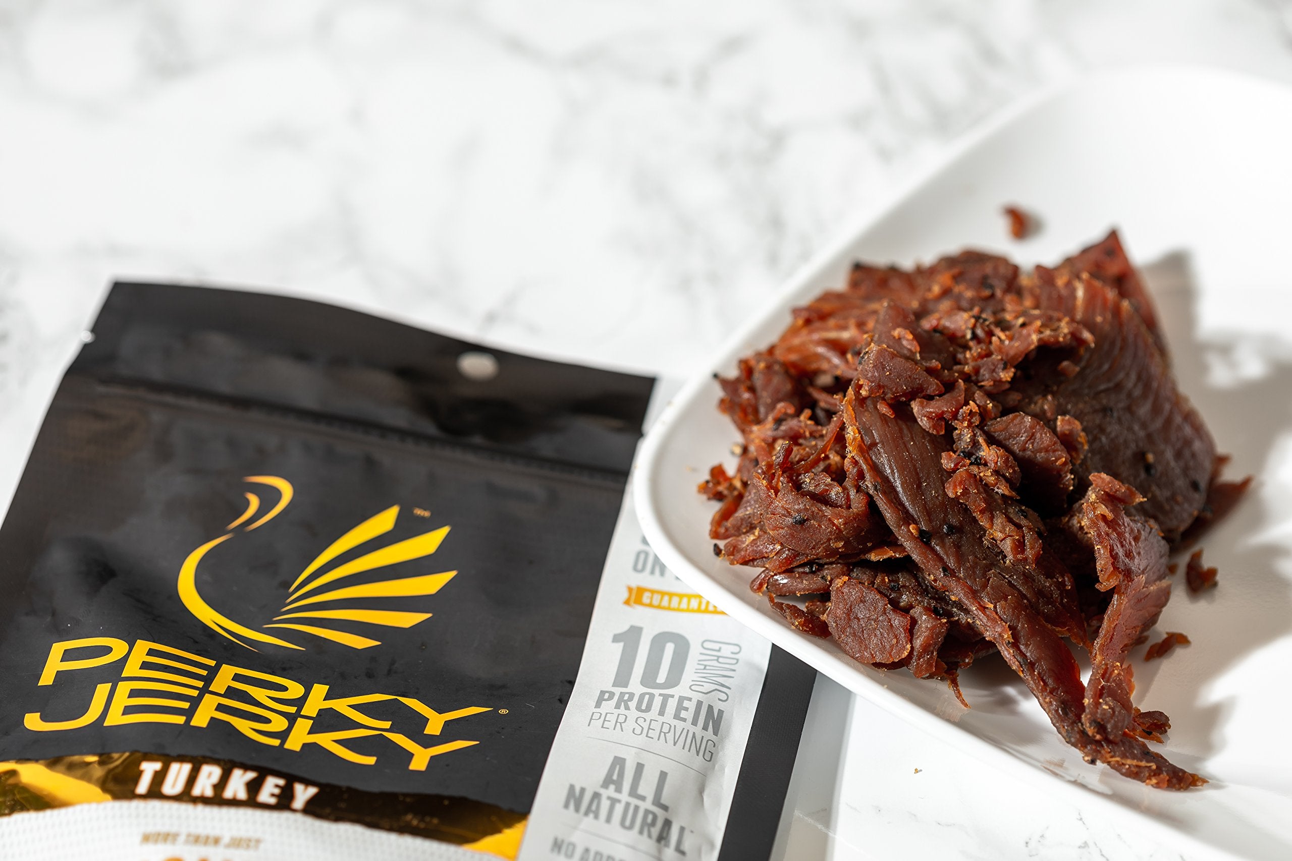 Perky Jerky porción en comparación con moneda para entender tamaño