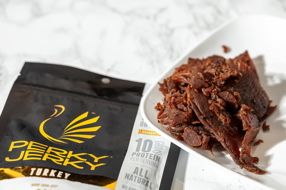 Perky Jerky porción en comparación con moneda para entender tamaño